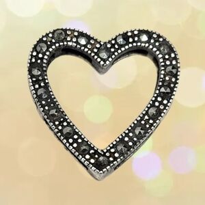 This Sterling .925 Silver Heart Shape Marcasite Stone Slide Open Sides Pendant